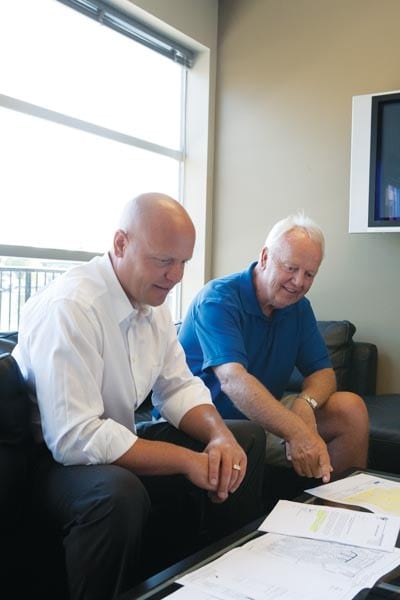 Kevin and Paul Taylor reviewing project plans